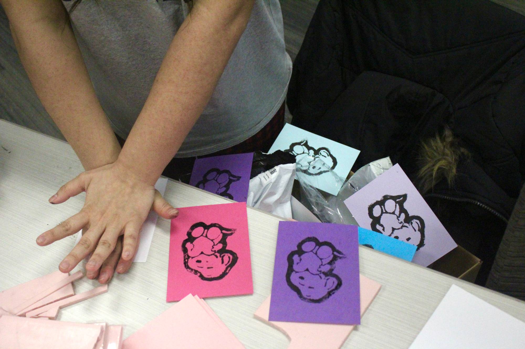 Student printing from a block carving